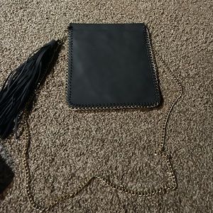 Black crossbody purse with gold strap